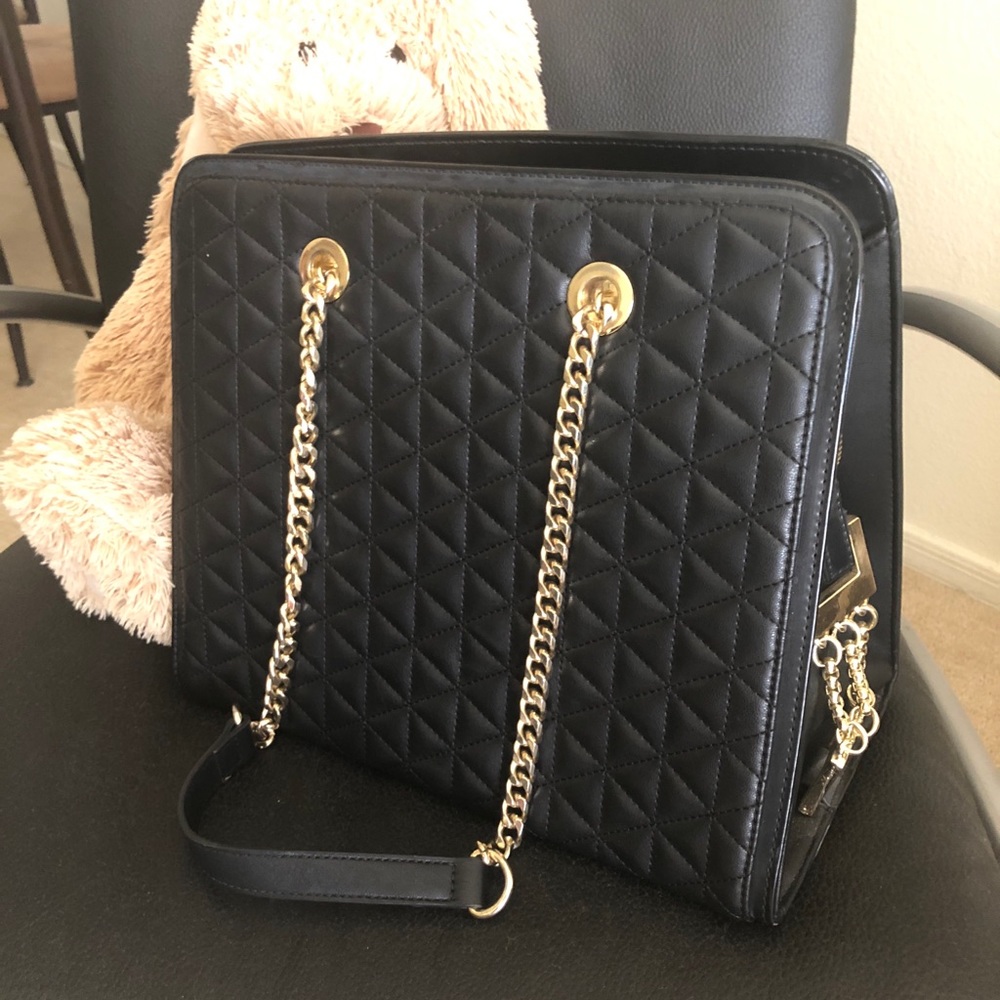 Classic Bebe bag with gold chain straps.